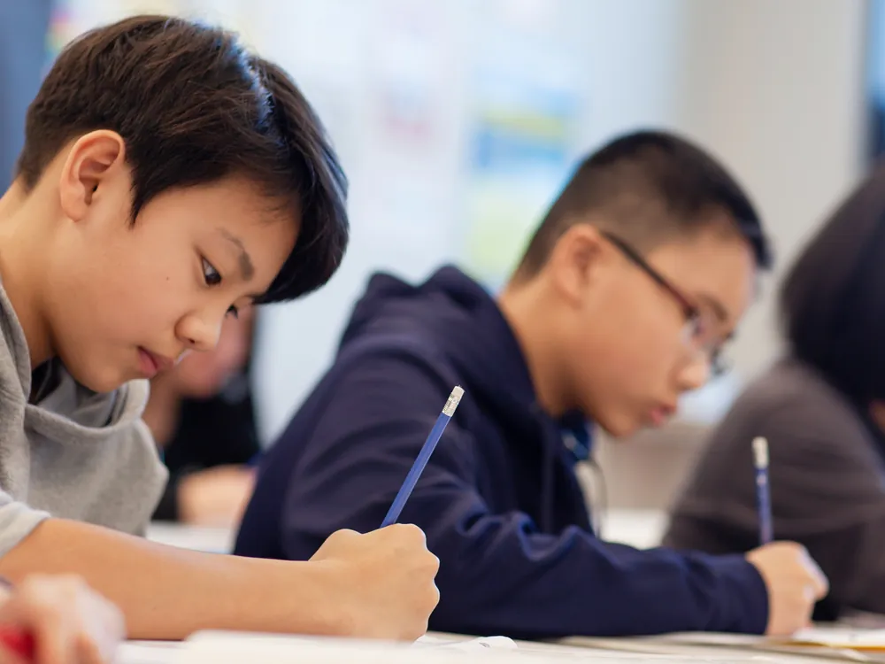 Students working through a practice exam paper